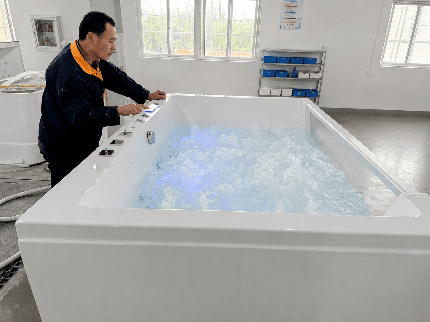 Finished bathtub undergoing final quality inspection
